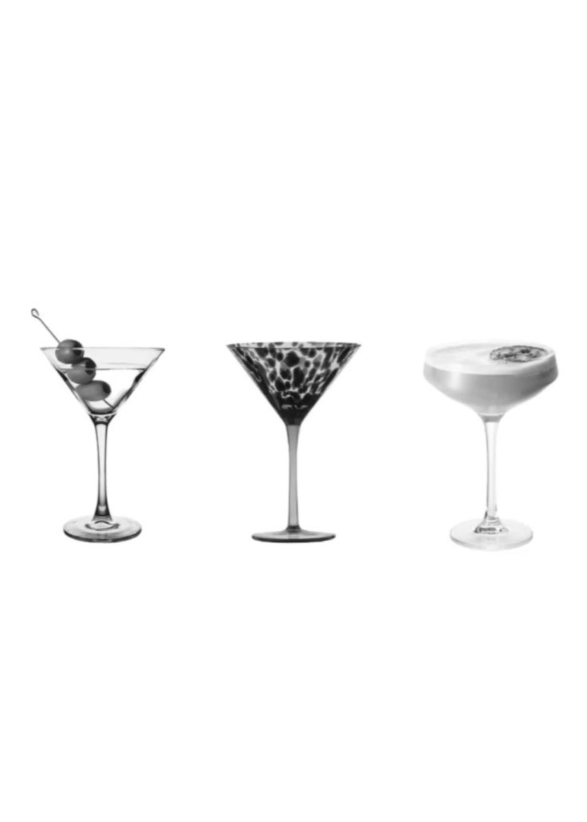 Tre cocktailglas i svartvitt mot vit botten